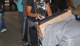 Kelly Rowland and Tim Witherspoon arrive at LAX
