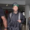 Tyga catches a flight out of LAX with his entourage
