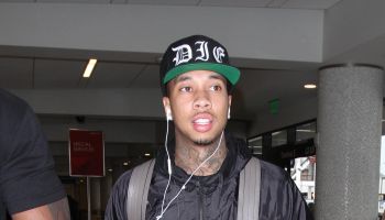 Tyga catches a flight out of LAX with his entourage