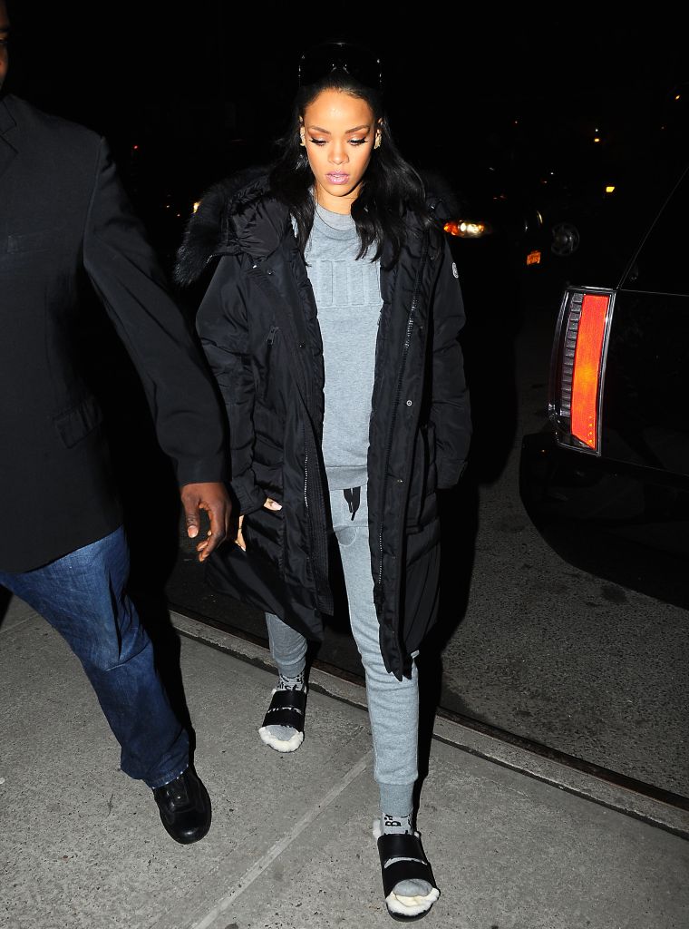 It's gotta be the shoes. Rihanna wears furry slippers while out in NYC.