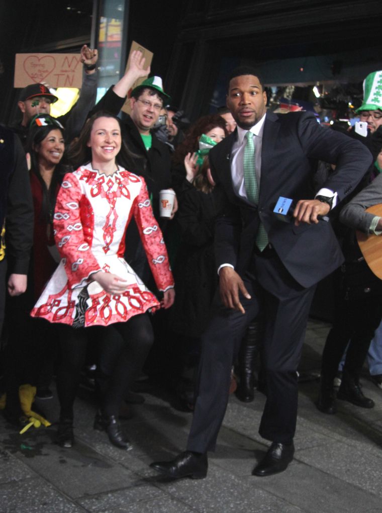 Do your dance! Michael Strahan does his best Irish stepping in NYC.