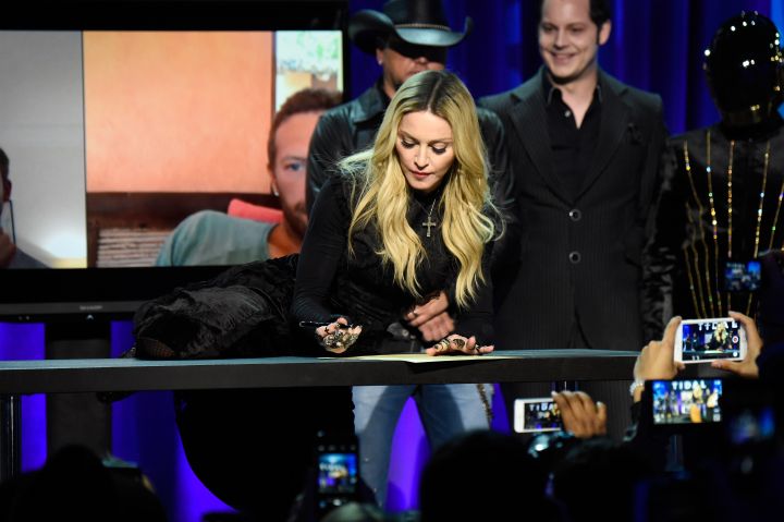 Madonna does the most Madonna thing while signing the declaration.