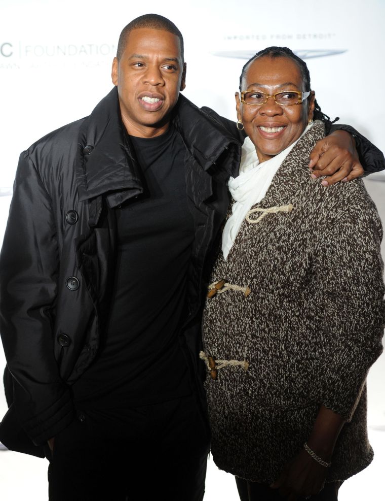 Jay Z embraces his mom Gloria Carter and shows off his millionaire dollar smile.