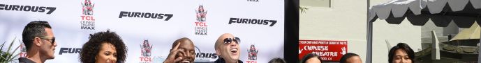 Vin Diesel poses with actors Tyrese Gibson (C-L) and Michelle Rodriguez (C-R) and other member of the 'Furious 7' cast as he is honored with a hand and footprint ceremony