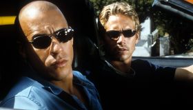 Vin Diesel and Paul Walker looking from car in a scene from the film 'The Fast And The Furious', 2001.