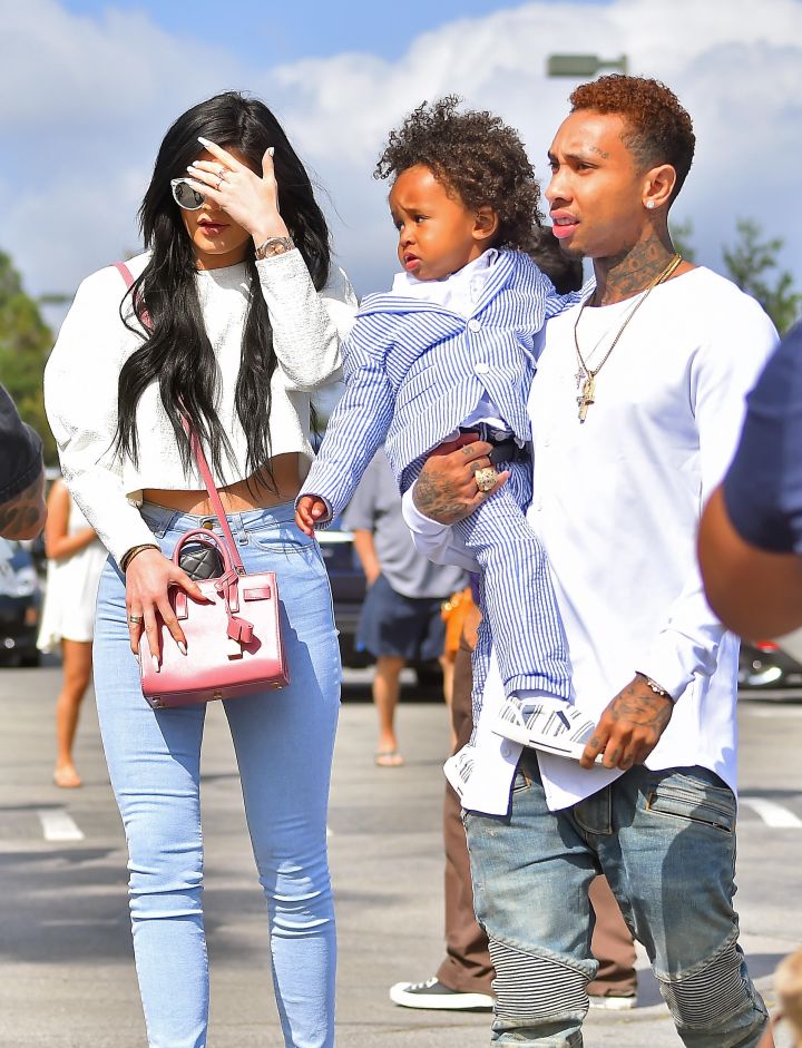 Here is a blessed image of Kylie Jenner, her older male friend Tyga, and his son heading into church to hear the good word.