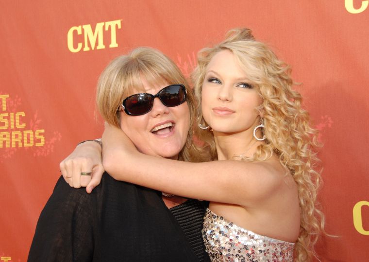 Taylor’s Got A Tight Hold On Her Mommy.