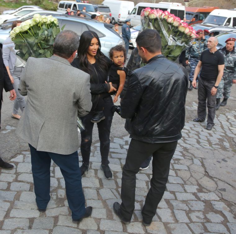 North even flashed the side-eye to those trying to give her mommy flowers.