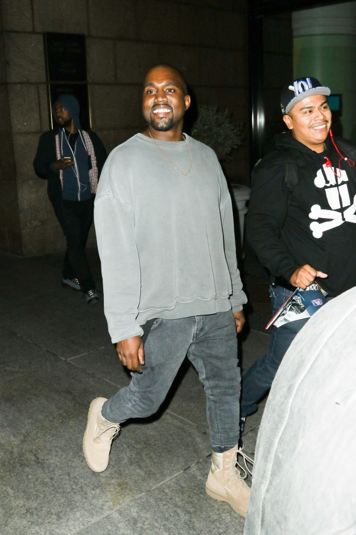 Kanye West shares a million dollar smile while exiting the Polo Bar in New York City.
