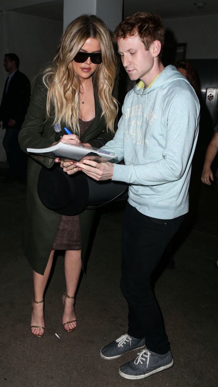 Khloe Kardashian shows a fan some love at LAX airport.