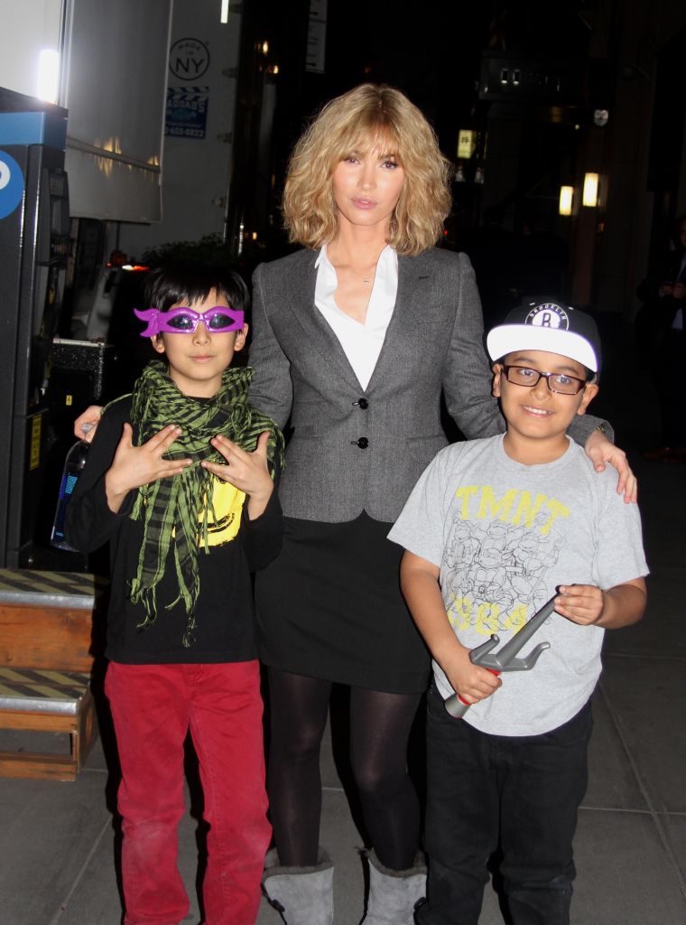 Megan Fox was seen wearing a blonde wig as she posed with two fans on the "Teenage Mutant Ninja Turtles 2" set.