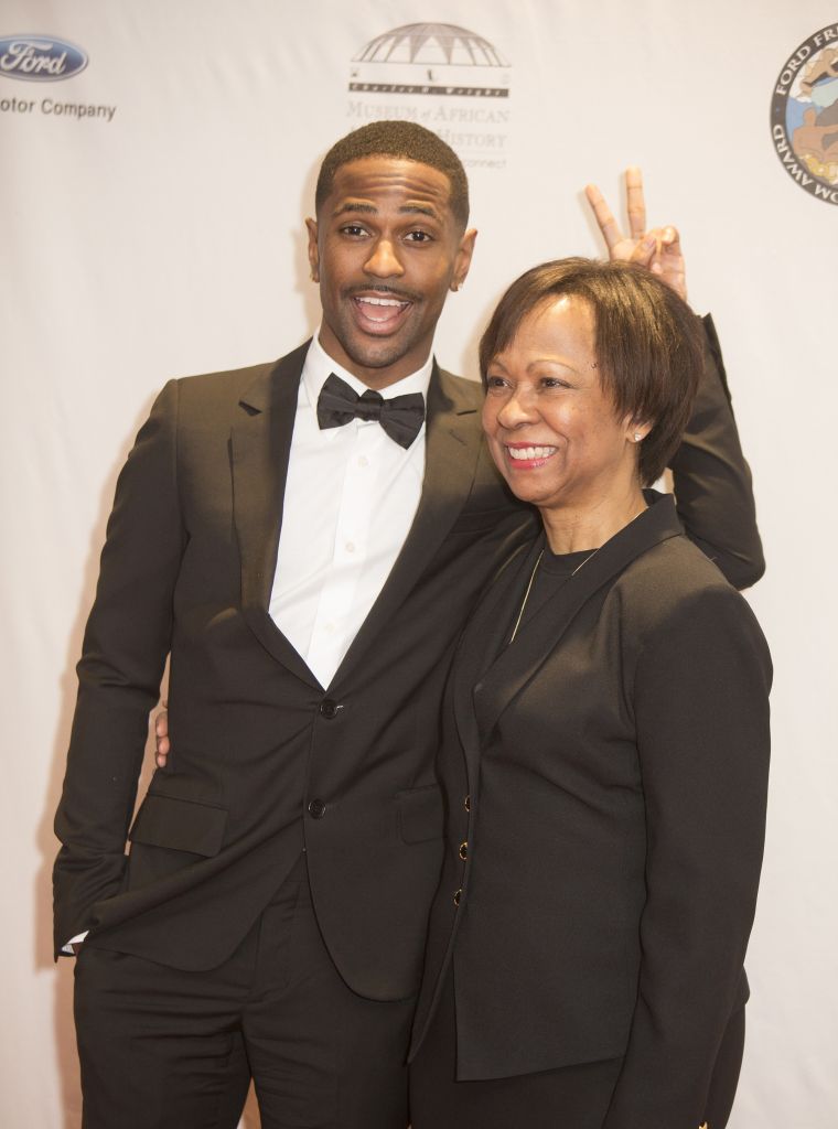Got em! Big Sean throws rabbit ears behind his mom Myra Anderson at the 17th Annual Ford Freedom Awards at Max Fischer Music Center on May 5, 2015 in Detroit, Michigan.