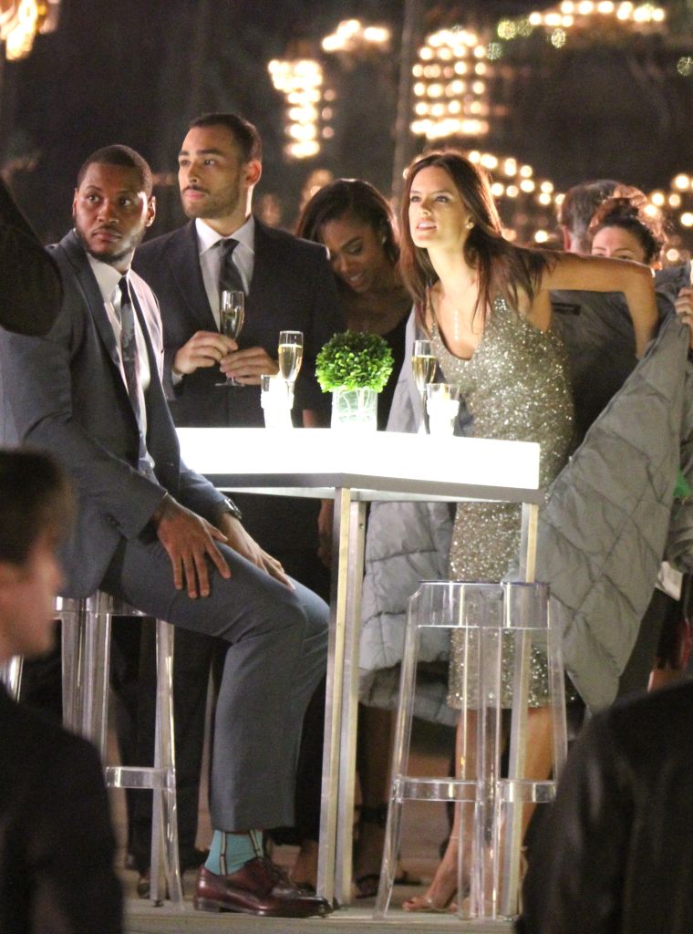 Carmelo Anthony and Alessandra Ambrosio sit down between takes on the set of "Teenage Mutant Ninja Turtles 2."