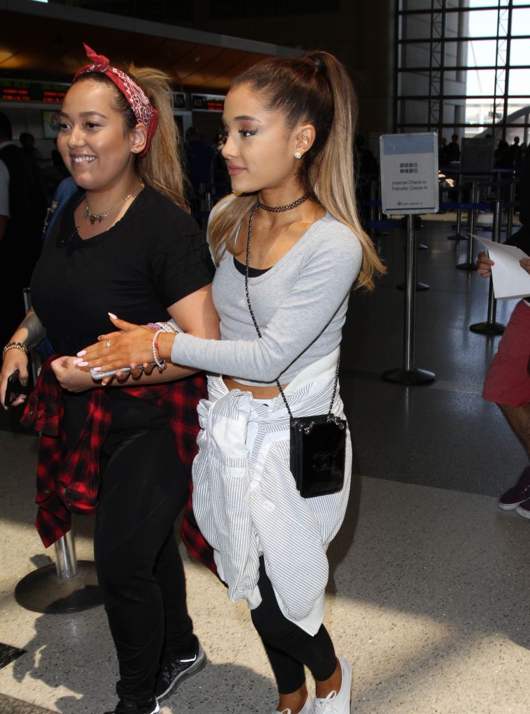 Ariana Grande headed inside LAX airport with a friend as she prepared for a trip.