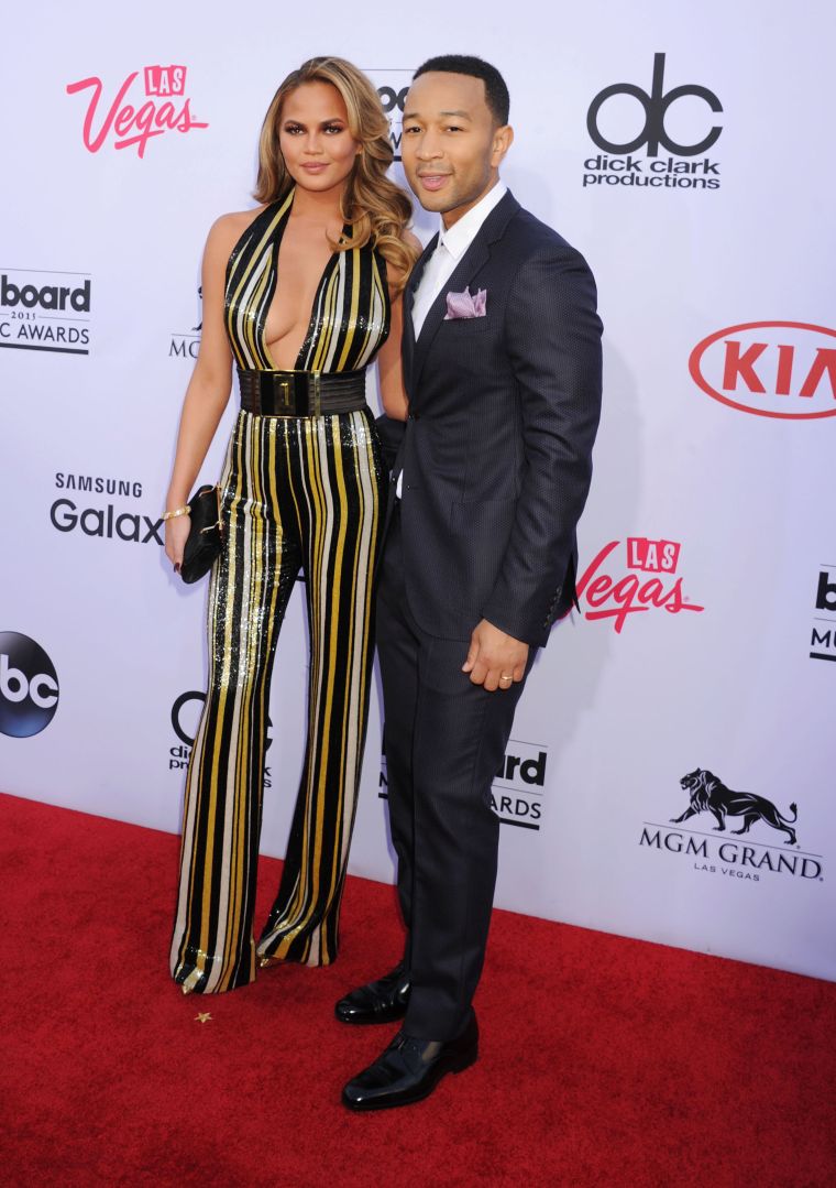 Chrissy Teigen and John Legend flashed million dollar smiles.