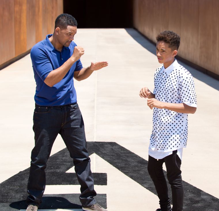 Jaden Smith learning how to box from his father.
