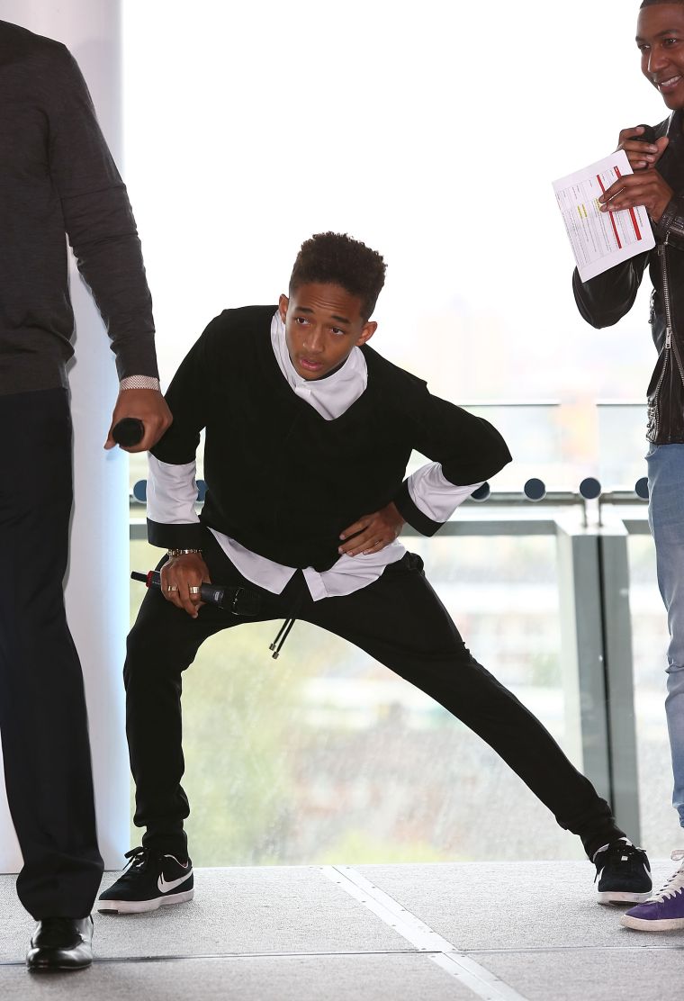 Jaden Smith stretching out his hamstring.