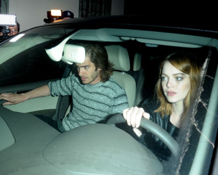 Emma and Andrew went out to the Troubadour in Los Angeles, CA. After Andrew ran out to bring the car around the back door, he jumped out of the car 3 times to talk to photographers while Emma attempted to drive away.