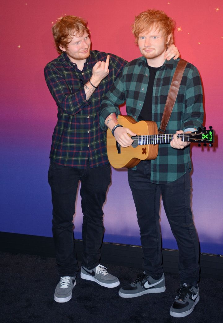 Ed Sheeran poses next to his new wax figure at Madam Tussauds.