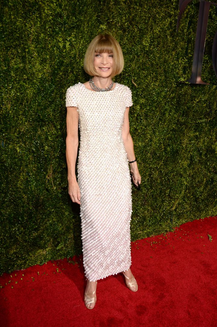 On hand to assist stars with their fashion, Anna Wintour walked the red carpet in white.