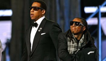 Jay Z performs with Lil Wayne and T.I at the Grammy Awards