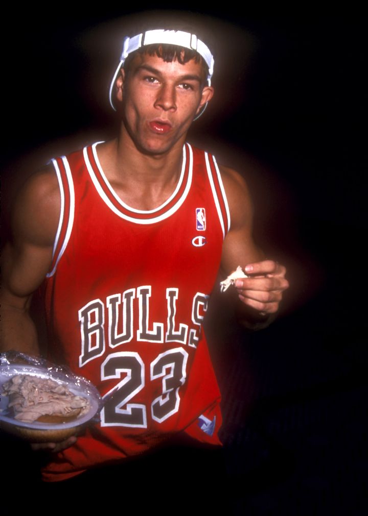 Mark Wahlberg used to be a rapper by the name of Marky Mark. Here he is eating chicken.