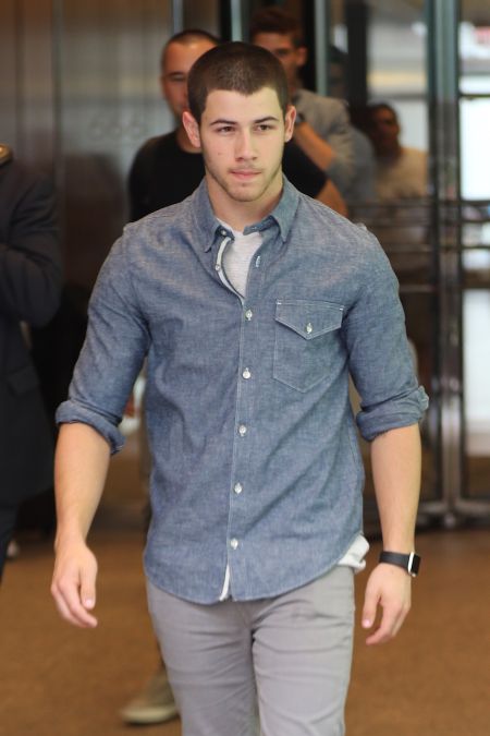 Nick Jonas sports the Apple Watch while out and about in NYC.
