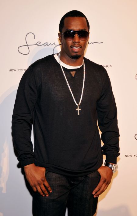 Diddy nurturing his baby, Sean John, in 2008.