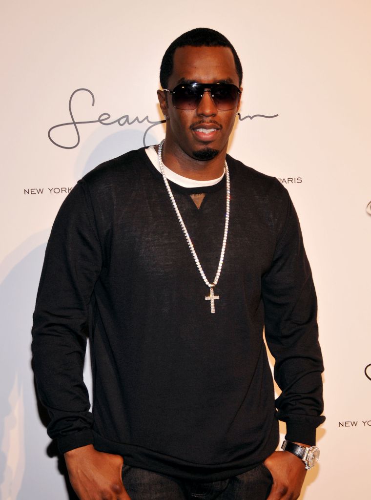 Diddy nurturing his baby, Sean John, in 2008.