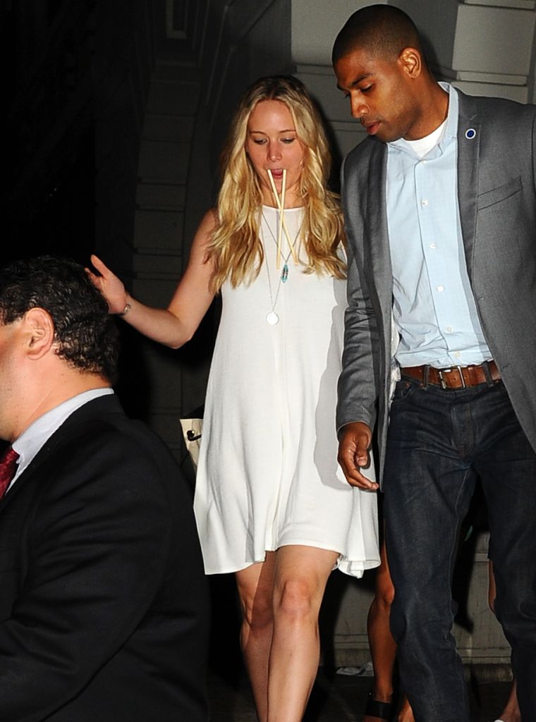 Jennifer Lawrence leaves Nobu in Tribeca with chopsticks in her mouth and a hunky guy on her arm.