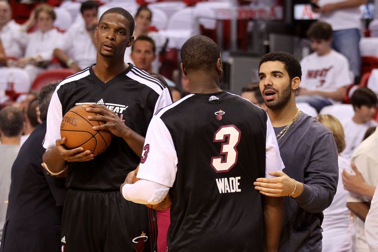 Drake chats it up with D-Wade and Chris Bosh courtside.
