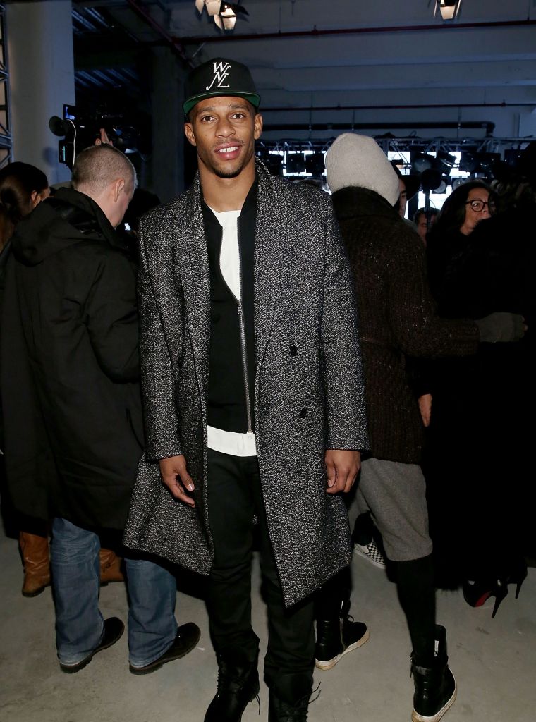 Cruz poses while front row at the Public School runway show.