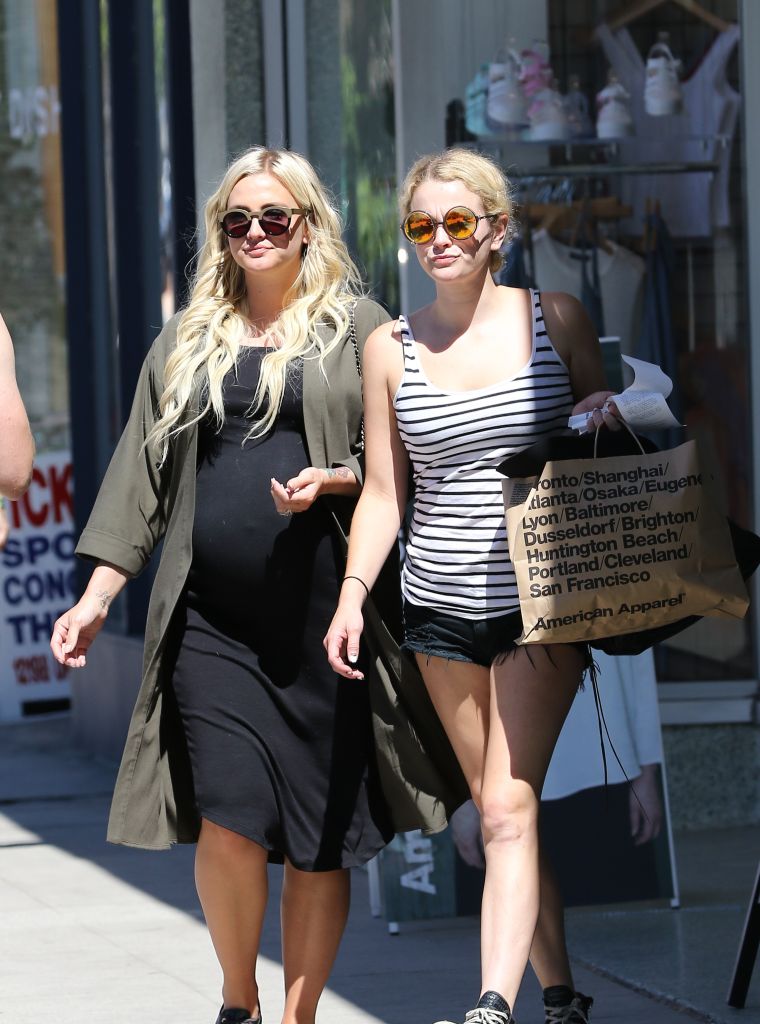 Ashlee Simpson puts her growing baby bump on full display while out and about with a friend in L.A.