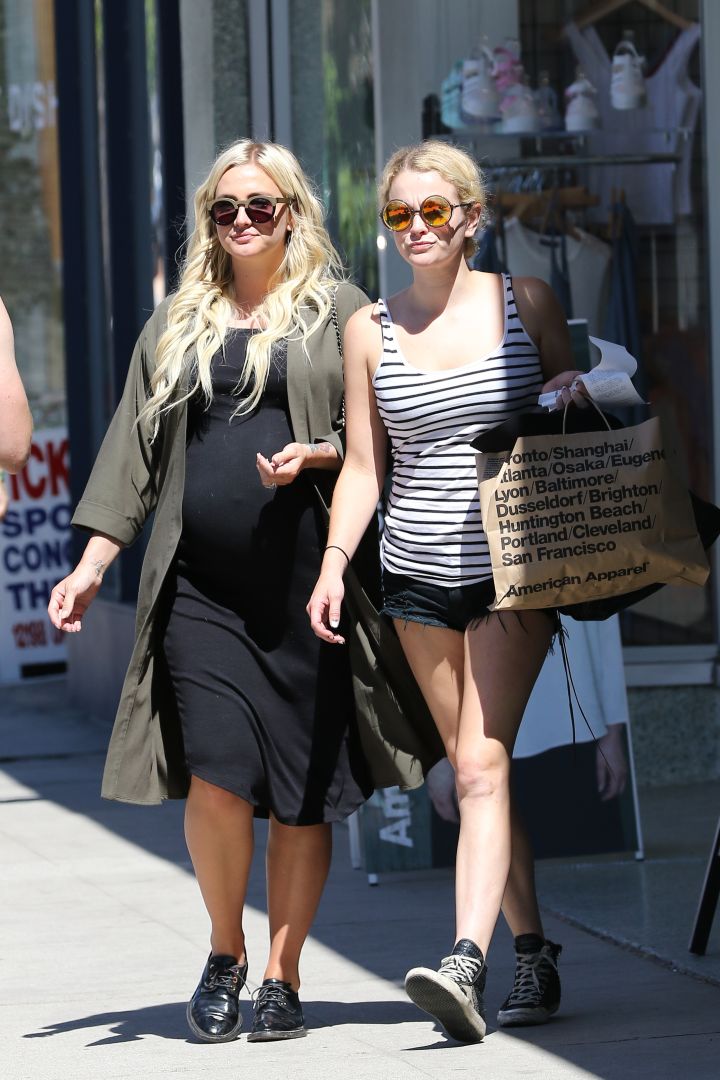 Ashlee Simpson puts her growing baby bump on full display while out and about with a friend in L.A.