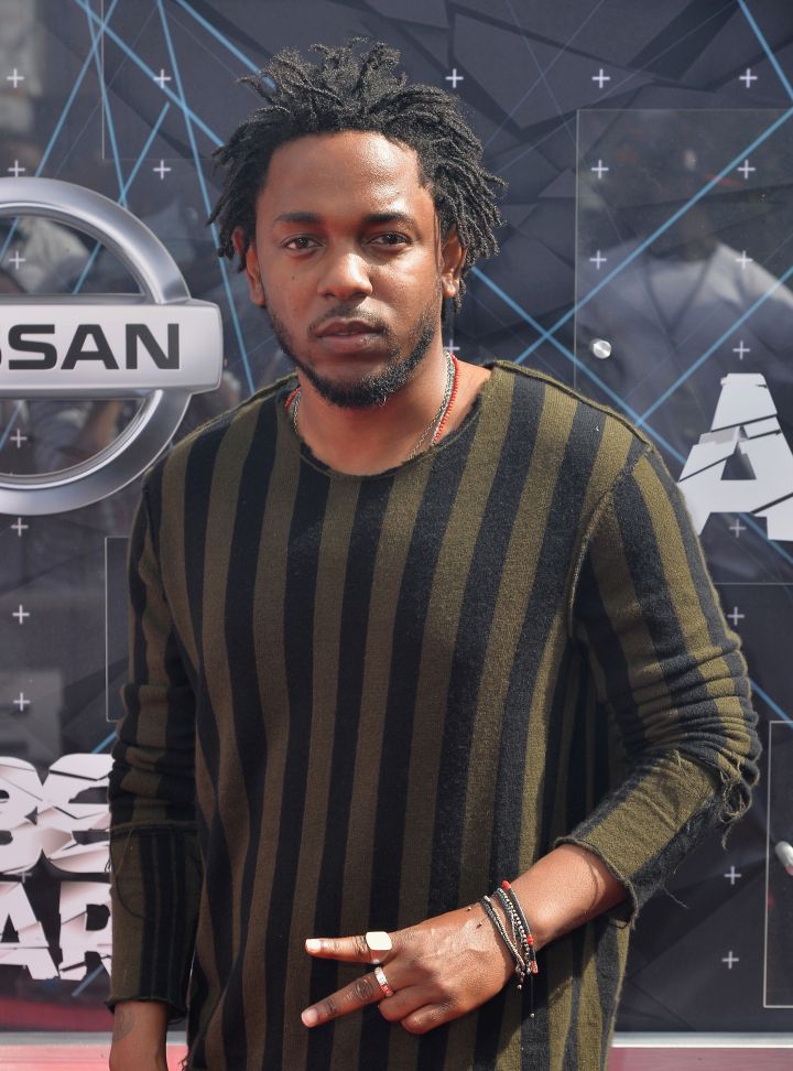 Kendrick Lamar was cool in his striped tribal shirt and simple black jeans.