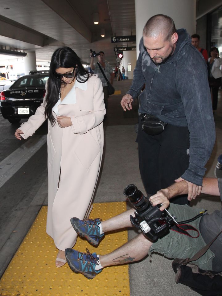 Kim Kardashian had a close call as she tried to pass the paparazzi while arriving at LAX.