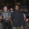 Kanye West is mobbed by autograph collectors as he arrives in Los Angeles