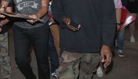 Kanye West is mobbed by autograph collectors as he arrives in Los Angeles
