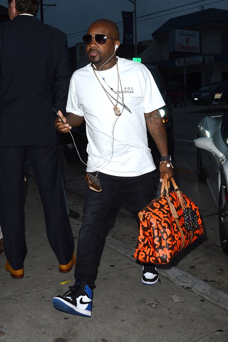 Jermaine Dupri was so so def as he carried a bright orange Louis Vuitton bag.