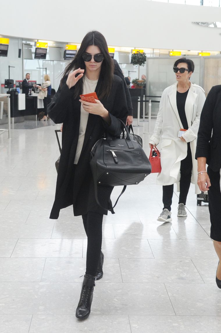 Kendall Jenner doesn’t want to be bothered in LAX as Kris Jenner follows close behind.