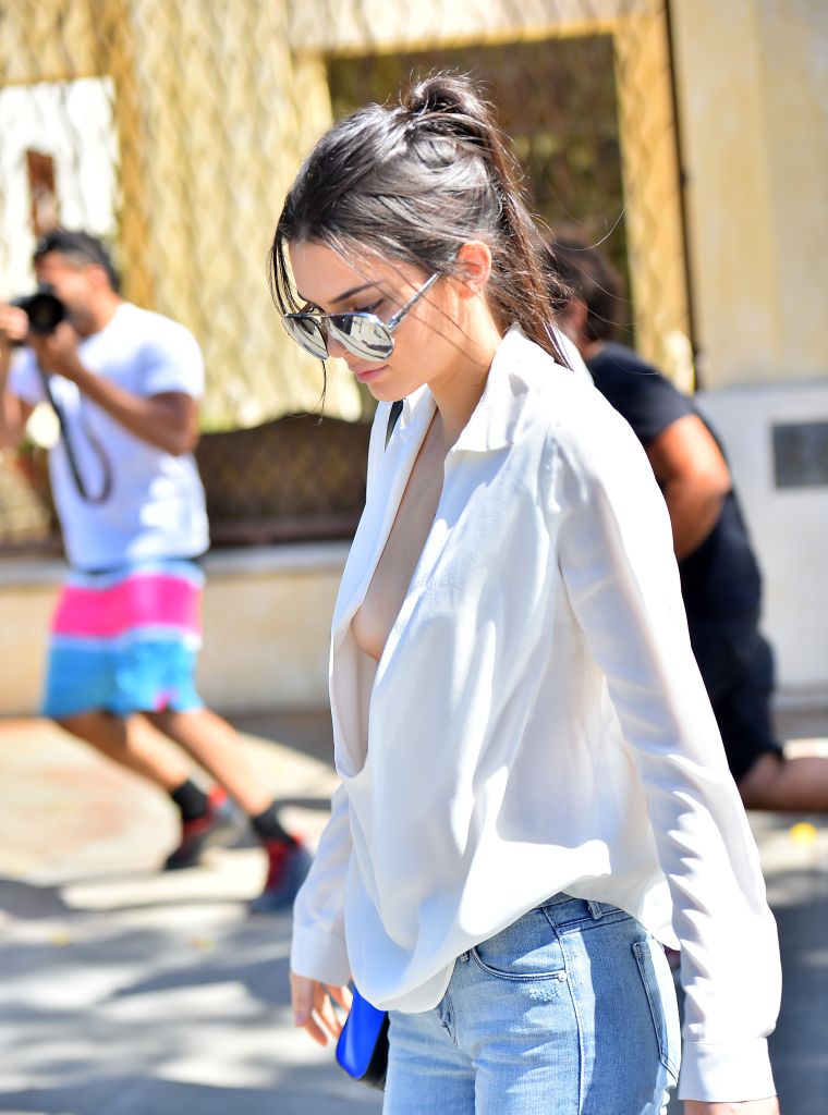Kendall Jenner was putting that tape to work as she barely avoided a nip slip while getting ice cream with a friend.