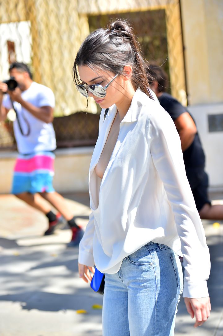 Kendall Jenner was putting that tape to work as she barely avoided a nip slip while getting ice cream with a friend.