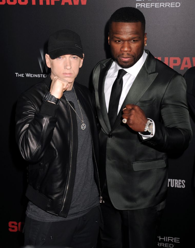 50 Cent and Eminem tag team the “Southpaw” premiere red carpet in NYC.