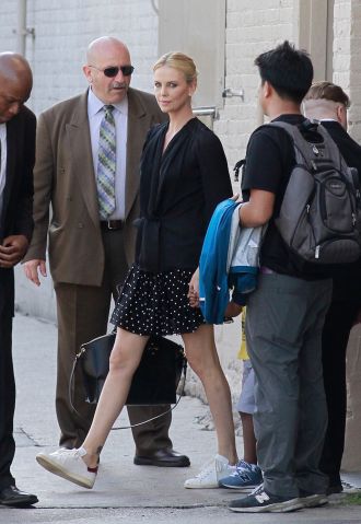 Charlize Theron exits the back of the 'Jimmy Kimmel Live' studios in Los Angeles.