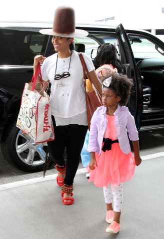 Singer Erykah Badu and her family are spotted at LAX Airport in Los Angeles, Ca