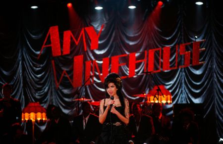 Amy performs for the 50th Grammy Awards ceremony via video link in 2008.