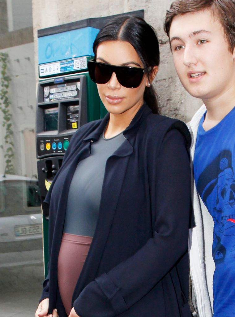 Pregnant Kim Kardashian was spotted out and about in Paris while posing with a lucky fan.