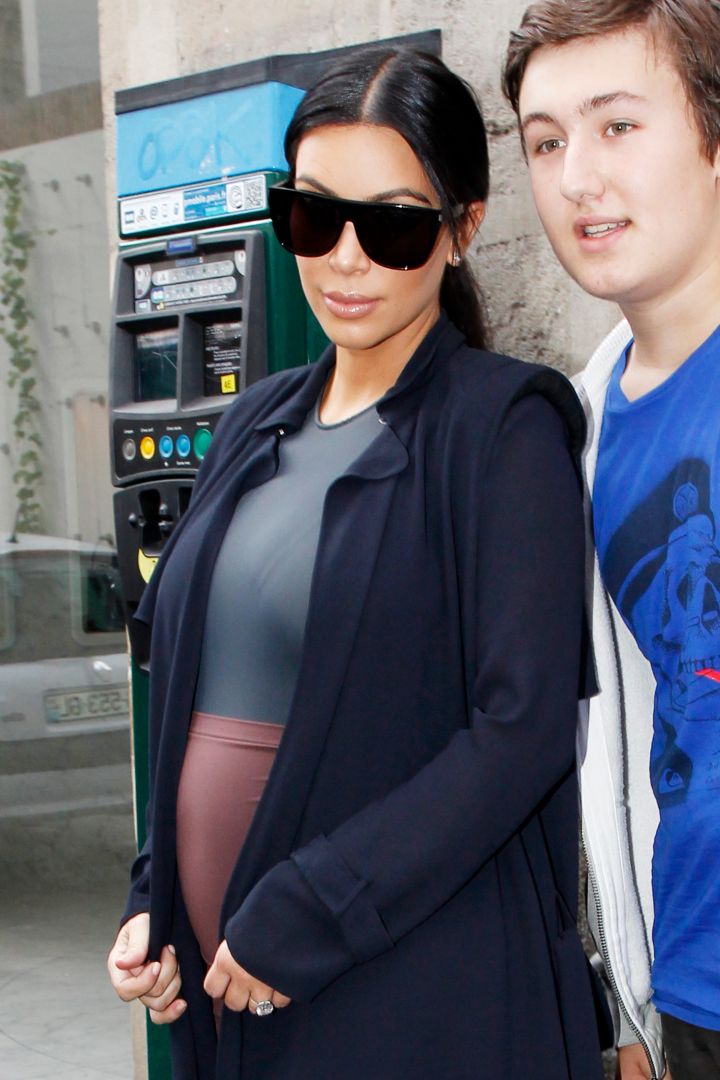 Pregnant Kim Kardashian was spotted out and about in Paris while posing with a lucky fan.