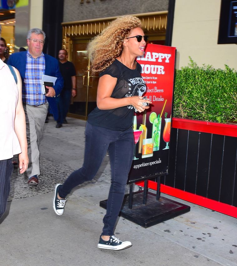 Stand down, Bey Hive. It’s just Beyonce running through the tourists in Times Square, attempting to go unseen. She dashed past a large Happy Hour sign, with her hair flowing in the breeze.