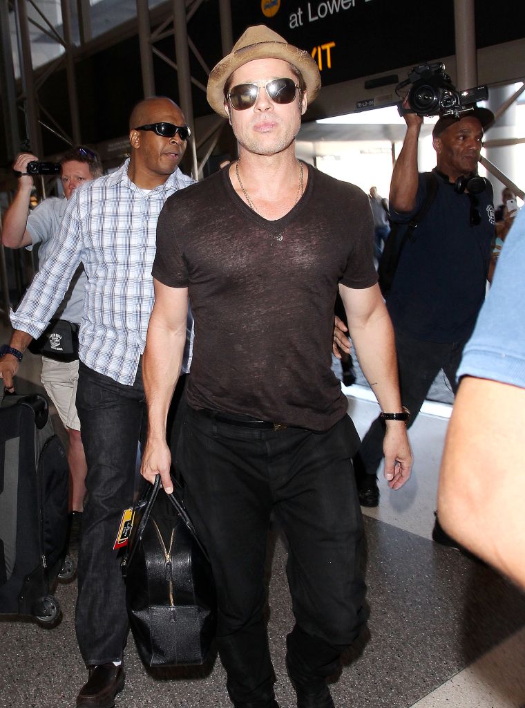 Brad Pitt rocked a super fitted shirt while arriving at Los Angeles International Airport.